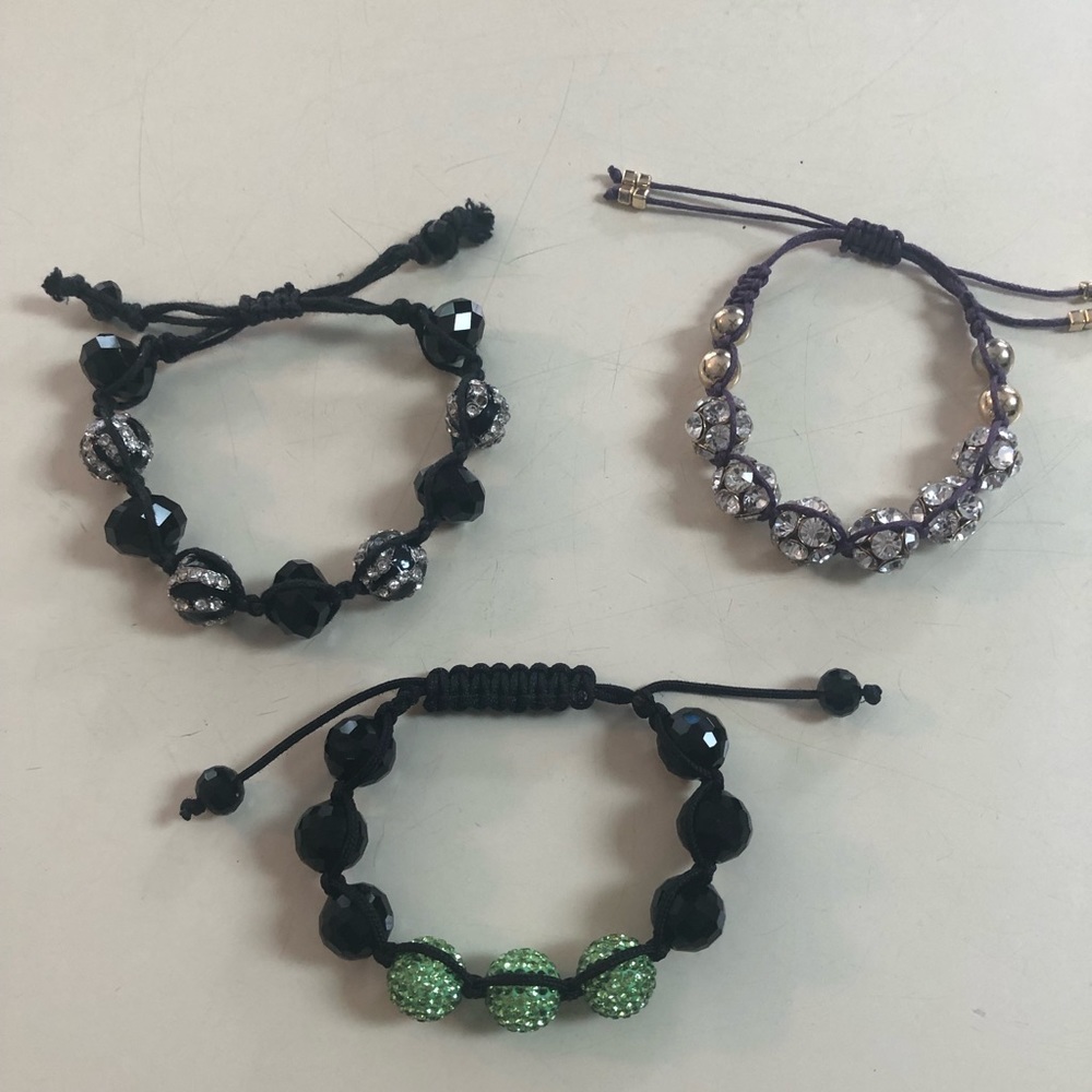 A bundle of three adjustable bracelets
